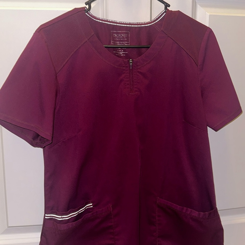 Burgundy scrub top.